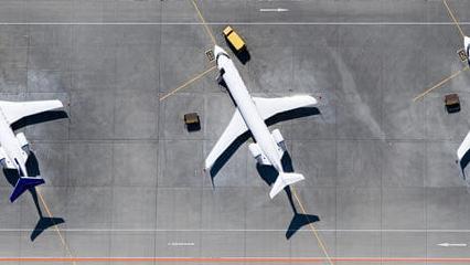 Aerial view of three airplanes at airport